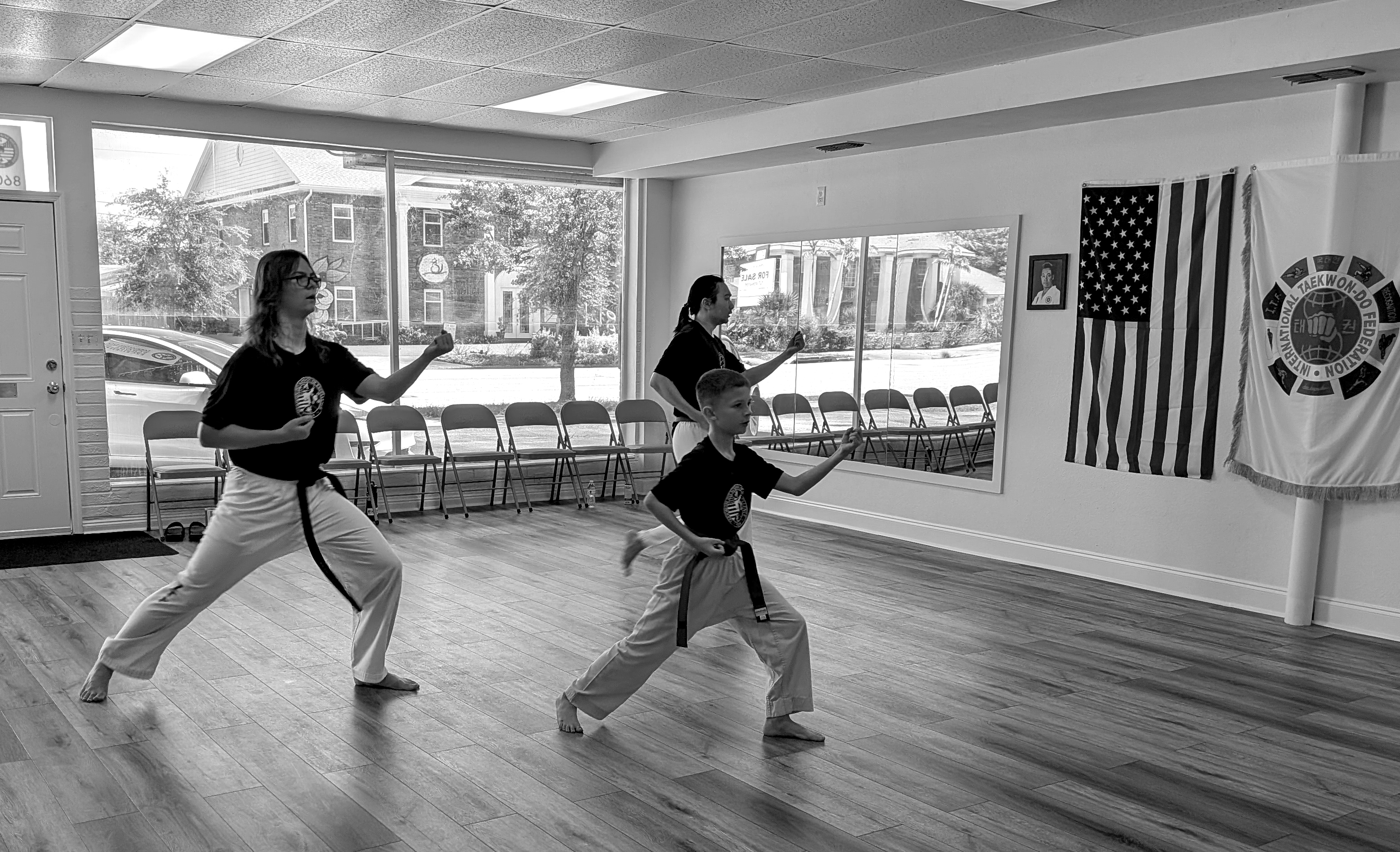 3 students performing a blocking stance